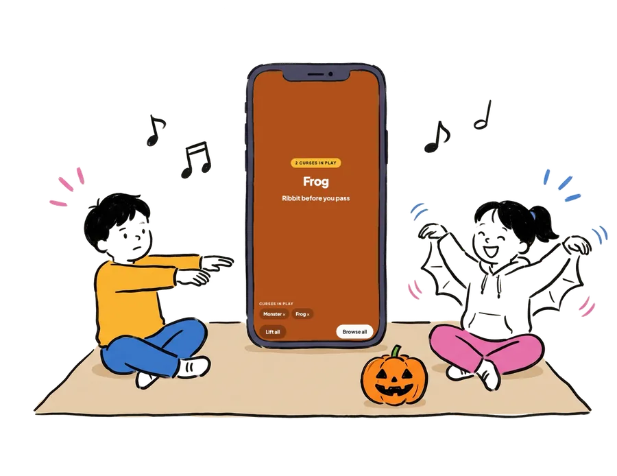 The curse flipper on a phone with two curses in play, while kids on a picnic blanket do zombie arms and bat wings around a jack-o'-lantern